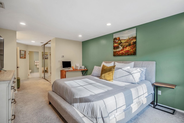 19 Hampshire Ct, Holbrook, NY 11741 - bedroom with light carpet, recessed lighting, ensuite bathroom, and baseboards