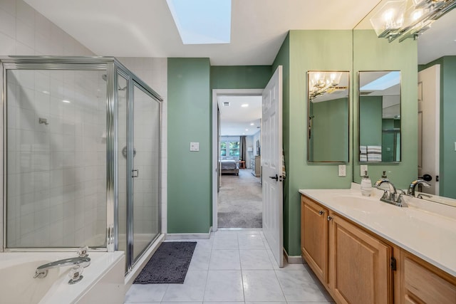 19 Hampshire Ct, Holbrook, NY 11741 - ensuite bathroom featuring a shower stall, a skylight, vanity, tile patterned floors, and a bath