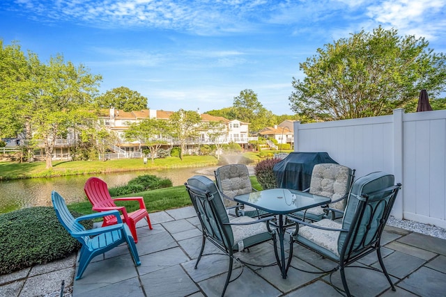 19 Hampshire Ct, Holbrook, NY 11741 - view of patio featuring outdoor dining area, a water view, and a residential view