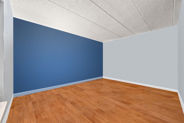 301 W 137th St Unit 301B, New York Manhattan, NY 10030 - additional living space with a textured ceiling, hardwood / wood-style flooring, and baseboards
