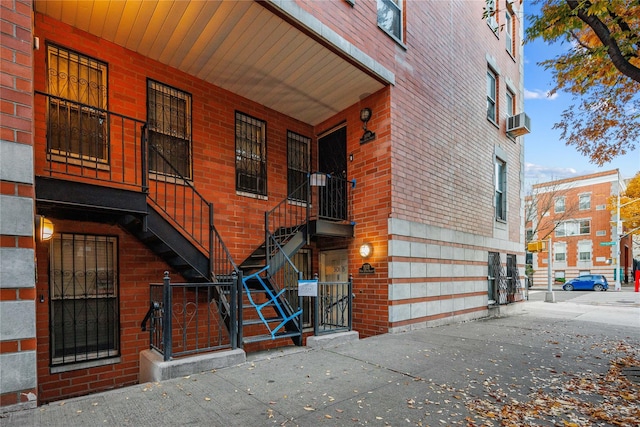 301 W 137th St Unit 301B, New York Manhattan, NY 10030 - entrance to property with brick siding, a porch, and a gate