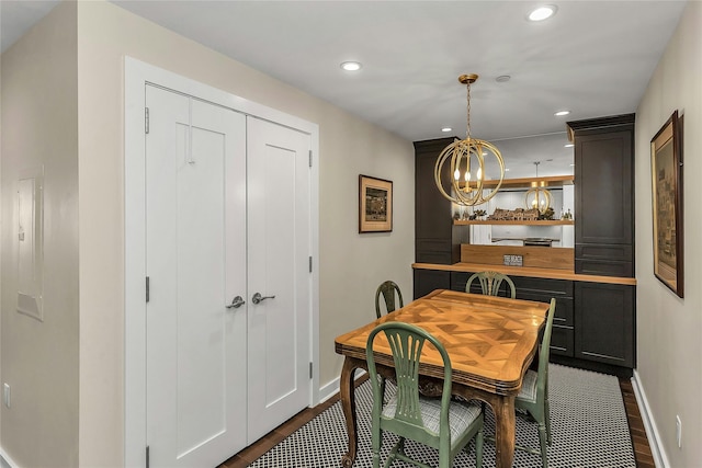 433 Main St Unit 203, Port Washington, NY 11050 - dining space with baseboards, a chandelier, recessed lighting, and dark wood-type flooring