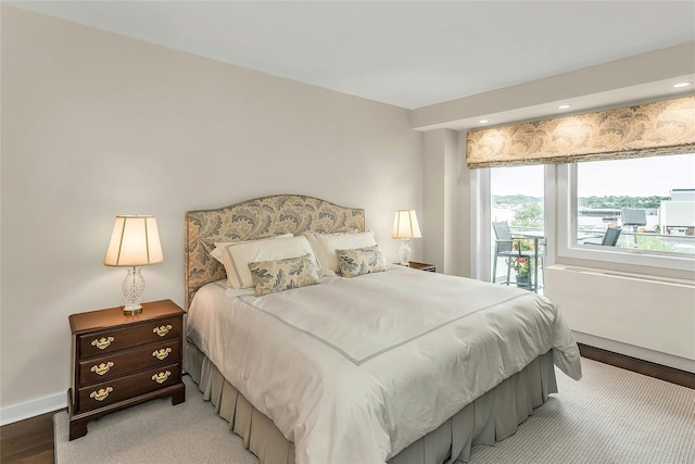 433 Main St Unit 203, Port Washington, NY 11050 - bedroom featuring access to outside, light wood finished floors, baseboards, and recessed lighting