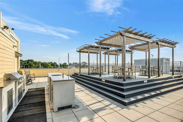433 Main St Unit 203, Port Washington, NY 11050 - view of patio featuring a pergola, a sink, and outdoor dining area