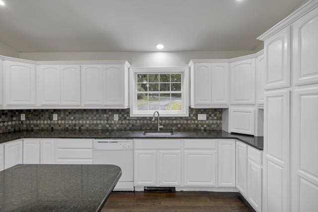 65 Old Cahoonzie Rd, Sparrowbush, NY 12780 - kitchen featuring white dishwasher, recessed lighting, a sink, dark wood-type flooring, and backsplash
