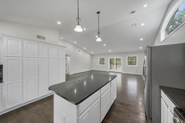 65 Old Cahoonzie Rd, Sparrowbush, NY 12780 - kitchen with dark wood-style flooring, freestanding refrigerator, range, white cabinets, and a center island