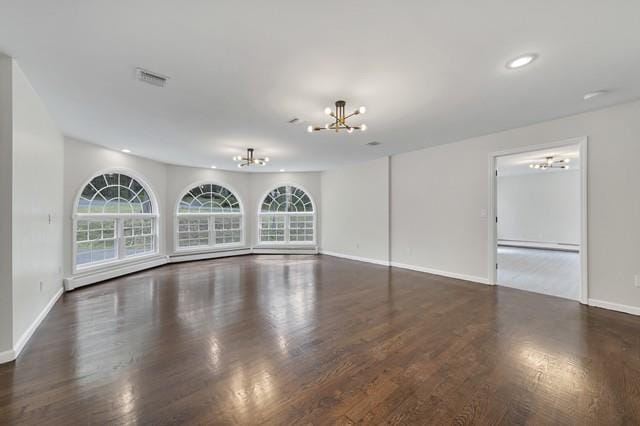 65 Old Cahoonzie Rd, Sparrowbush, NY 12780 - unfurnished living room featuring a chandelier, wood finished floors, baseboards, and recessed lighting
