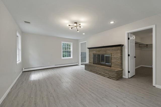 65 Old Cahoonzie Rd, Sparrowbush, NY 12780 - unfurnished living room featuring a baseboard heating unit, baseboards, wood finished floors, a chandelier, and recessed lighting