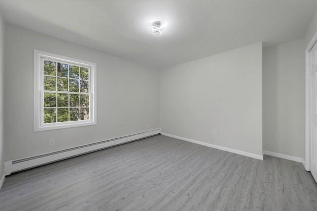 65 Old Cahoonzie Rd, Sparrowbush, NY 12780 - unfurnished room featuring a baseboard radiator, wood finished floors, and baseboards