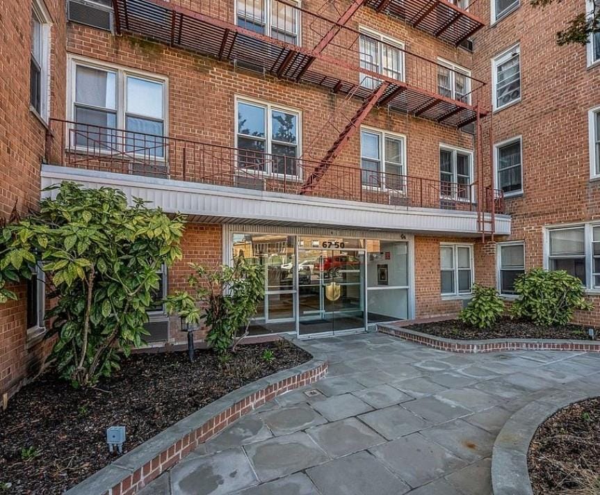 67-50 Thornton Pl Unit 3K, Forest Hills, NY 11375 - doorway to property featuring brick siding
