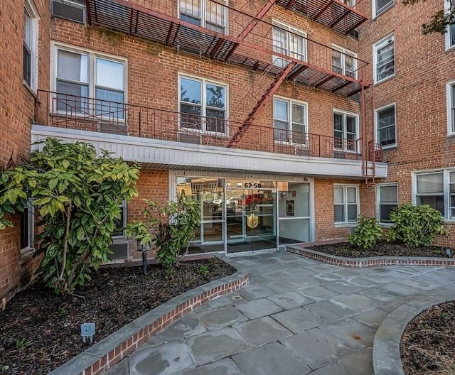 67-50 Thornton Pl Unit 3K, Forest Hills, NY 11375 - doorway to property featuring brick siding