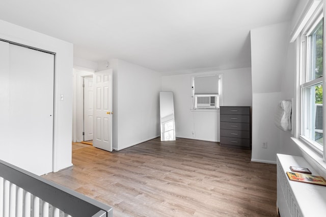 6 Cinque Dr, Farmingdale, NY 11735 - unfurnished living room featuring light wood-style flooring and baseboards