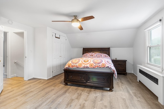 6 Cinque Dr, Farmingdale, NY 11735 - bedroom featuring radiator heating unit, light wood-type flooring, lofted ceiling, baseboards, and a ceiling fan