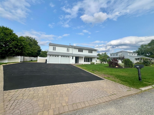 35 Thomas St, Coram, NY 11727 - traditional-style home featuring driveway and an attached garage