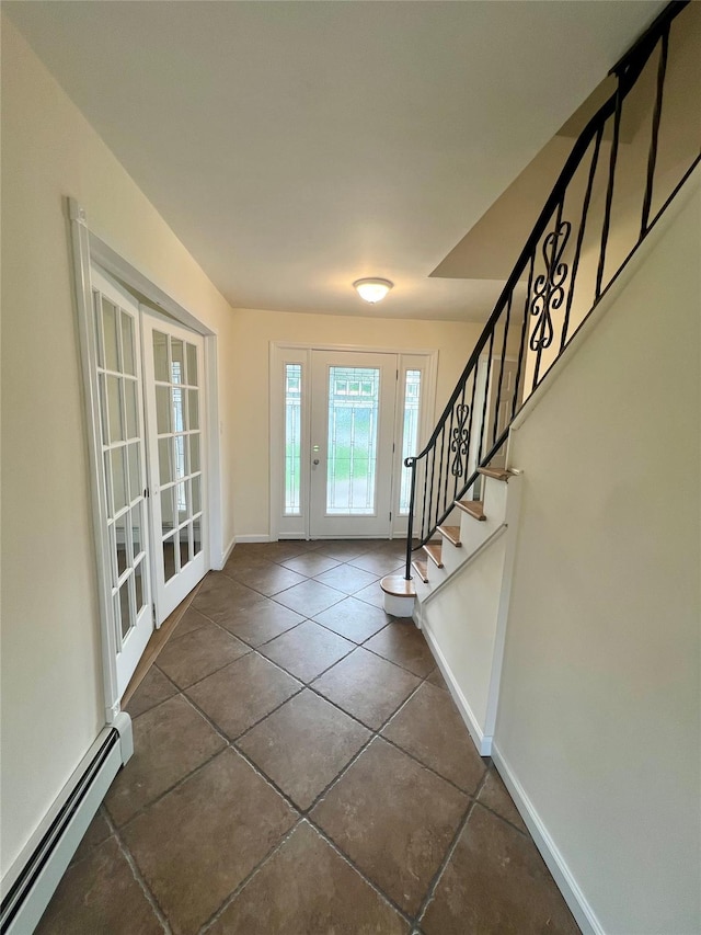 35 Thomas St, Coram, NY 11727 - foyer with baseboard heating, french doors, baseboards, stairway, and tile patterned floors