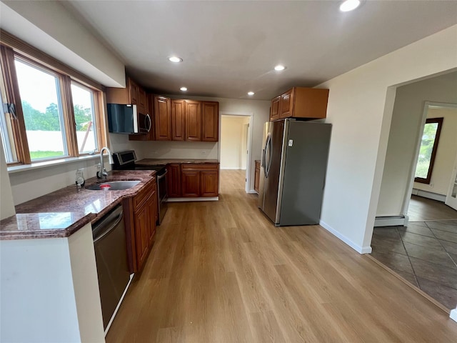 35 Thomas St, Coram, NY 11727 - kitchen with appliances with stainless steel finishes, a sink, baseboard heating, plenty of natural light, and recessed lighting