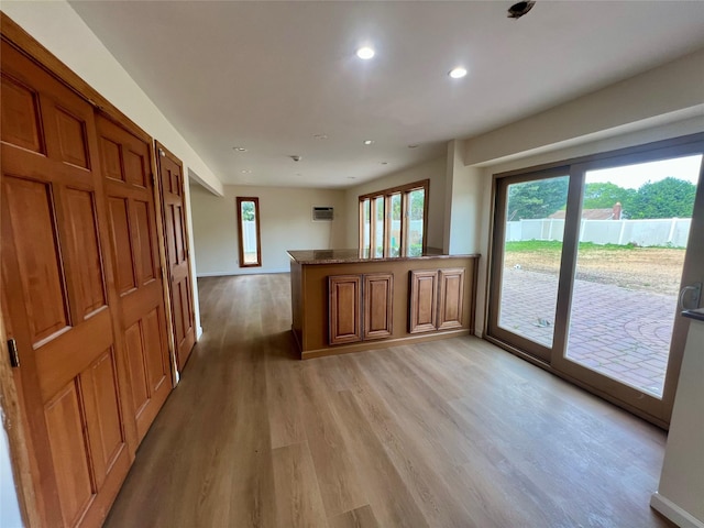 35 Thomas St, Coram, NY 11727 - unfurnished living room featuring light wood-style flooring, recessed lighting, and baseboards