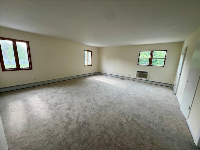 35 Thomas St, Coram, NY 11727 - empty room featuring a baseboard heating unit, light carpet, and baseboards