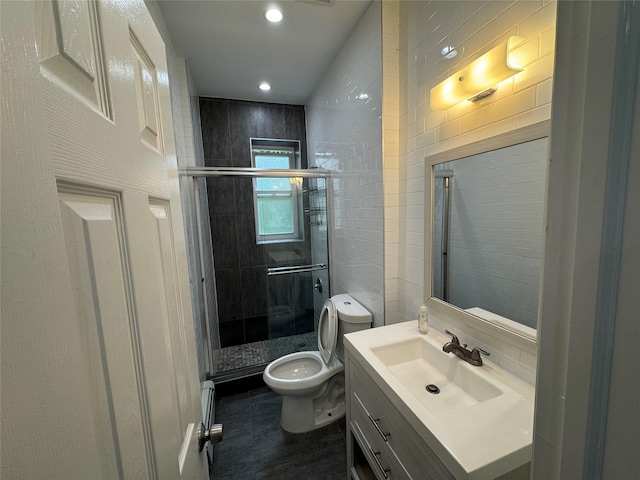 579 Van Siclen Ave, Brooklyn, NY 11207 - bathroom with toilet, a stall shower, vanity, tile walls, and recessed lighting
