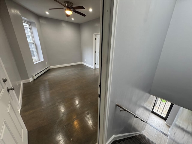 579 Van Siclen Ave, Brooklyn, NY 11207 - spare room featuring a baseboard heating unit, dark wood-style flooring, ceiling fan, recessed lighting, and baseboards