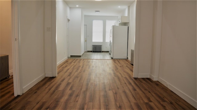 1420 Castleton Ave, Staten Island, NY 10302 - corridor with radiator, dark wood-type flooring, and baseboards