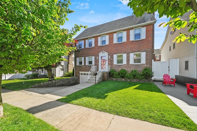 269 Hayward St, Yonkers, NY 10704 - view of front of home featuring brick siding, a garage, concrete driveway, and roof with shingles