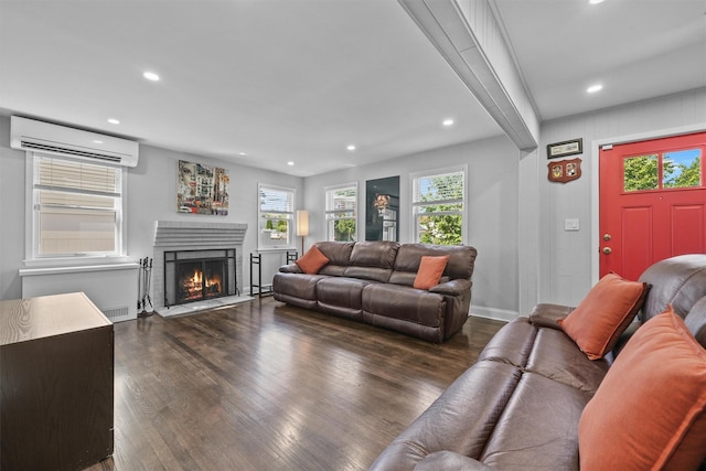 269 Hayward St, Yonkers, NY 10704 - living area with an AC wall unit, dark wood-style flooring, recessed lighting, a fireplace, and baseboards