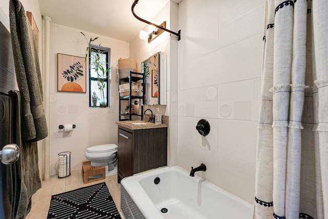 67-66 108th St Unit A32, Forest Hills, NY 11375 - bathroom with vanity, toilet, tile walls, tile patterned floors, and shower / tub combo with curtain