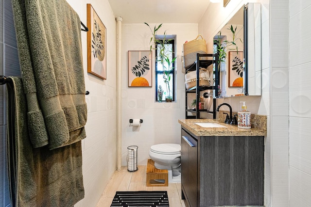 67-66 108th St Unit A32, Forest Hills, NY 11375 - bathroom with toilet, vanity, and tile walls