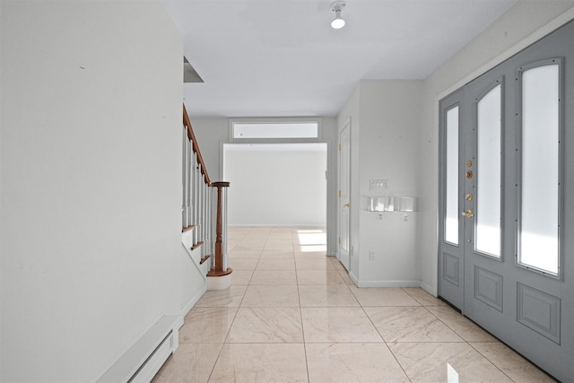 32 Wilder Rd, Monsey, NY 10952 - entrance foyer with stairs, light marble finish floors, baseboards, and a baseboard heating unit