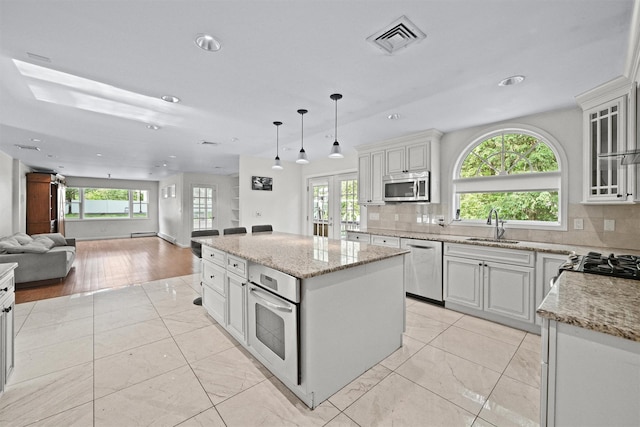 32 Wilder Rd, Monsey, NY 10952 - kitchen with stainless steel appliances, a sink, open floor plan, healthy amount of natural light, and recessed lighting