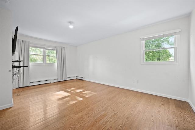 32 Wilder Rd, Monsey, NY 10952 - spare room with wood finished floors, baseboards, and a baseboard radiator