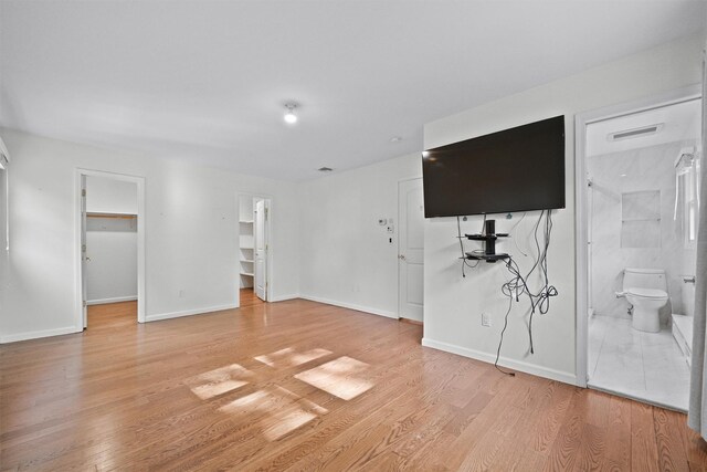 32 Wilder Rd, Monsey, NY 10952 - unfurnished living room with light wood finished floors and baseboards