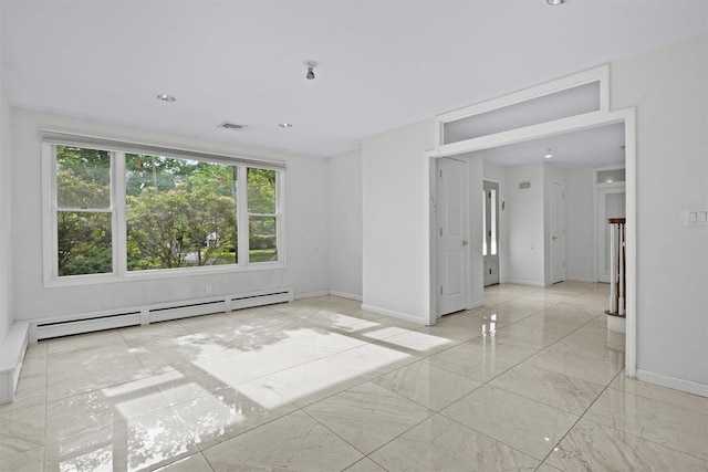 32 Wilder Rd, Monsey, NY 10952 - empty room featuring a baseboard heating unit, marble finish flooring, and baseboards