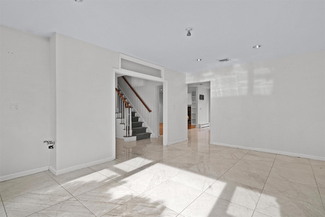 32 Wilder Rd, Monsey, NY 10952 - spare room with light marble finish floors, stairway, and baseboards