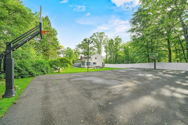 32 Wilder Rd, Monsey, NY 10952 - view of sport court featuring basketball hoop and view of wooded area