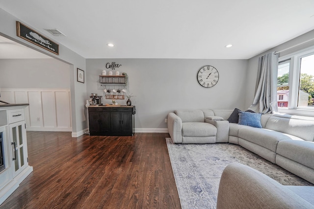 living area with wood finished floors, recessed lighting, and baseboards