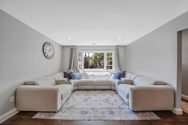 living area with wood finished floors, baseboards, and recessed lighting