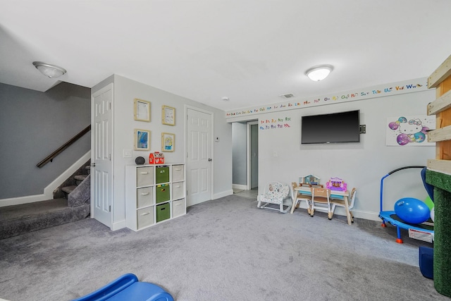 rec room with carpet flooring and baseboards