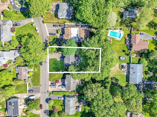 aerial view of property and surrounding area with property boundaries highlighted