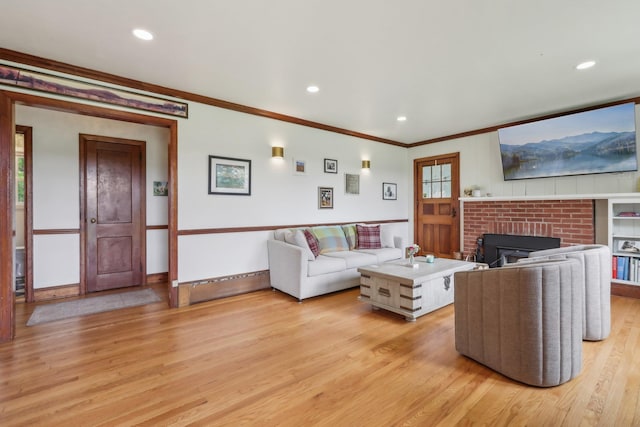 275 Otterkill Rd, Cornwall, NY 12553 - living room with crown molding, light wood-type flooring, recessed lighting, a fireplace, and baseboards