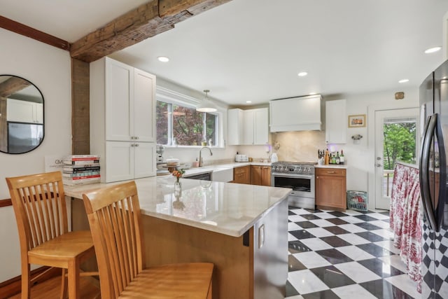 275 Otterkill Rd, Cornwall, NY 12553 - kitchen featuring high end stove, healthy amount of natural light, a peninsula, tile patterned floors, and recessed lighting