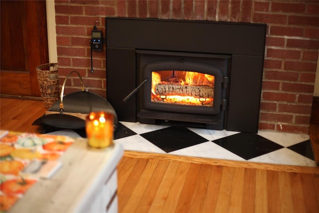 275 Otterkill Rd, Cornwall, NY 12553 - detailed view of a wood stove, wood finished floors, and brick wall
