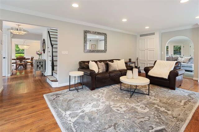 50 Kerry Ln, Chappaqua, NY 10514 - living area with arched walkways, recessed lighting, wood finished floors, crown molding, and baseboards