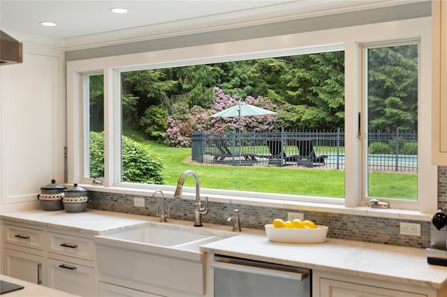 50 Kerry Ln, Chappaqua, NY 10514 - kitchen featuring dishwasher, a sink, tasteful backsplash, white cabinetry, and crown molding