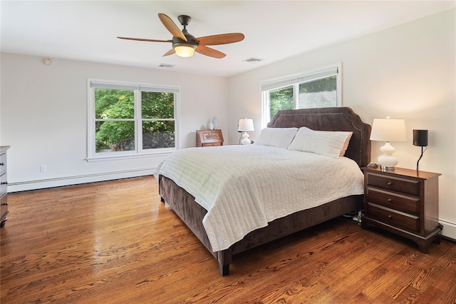 50 Kerry Ln, Chappaqua, NY 10514 - bedroom featuring a baseboard heating unit, wood finished floors, and a ceiling fan