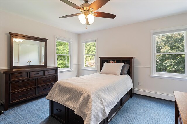 50 Kerry Ln, Chappaqua, NY 10514 - bedroom with a baseboard radiator, dark carpet, baseboards, and ceiling fan