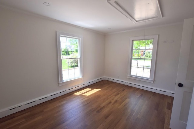 9 Circuit Rd, Bellport Village, NY 11713 - spare room with attic access, healthy amount of natural light, wood finished floors, and ornamental molding