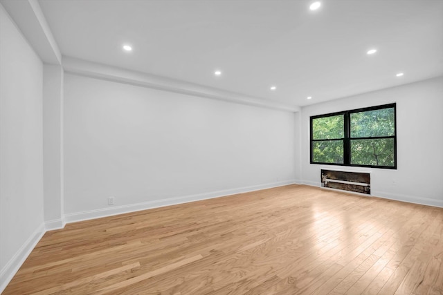 99-52 66th Rd Unit 3G, Rego Park, NY 11374 - empty room with light wood-style floors and recessed lighting