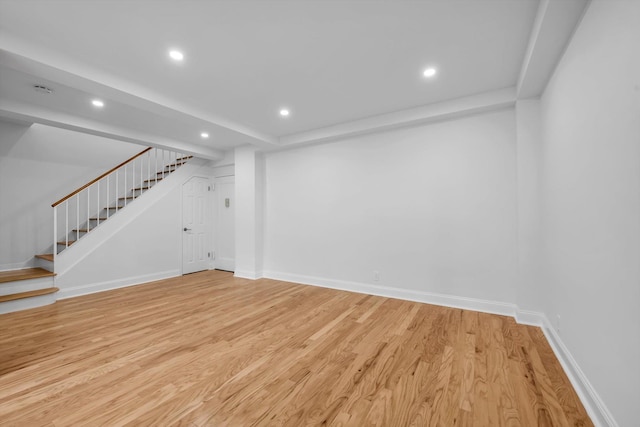 99-52 66th Rd Unit 3G, Rego Park, NY 11374 - basement featuring stairway, recessed lighting, and light wood-type flooring